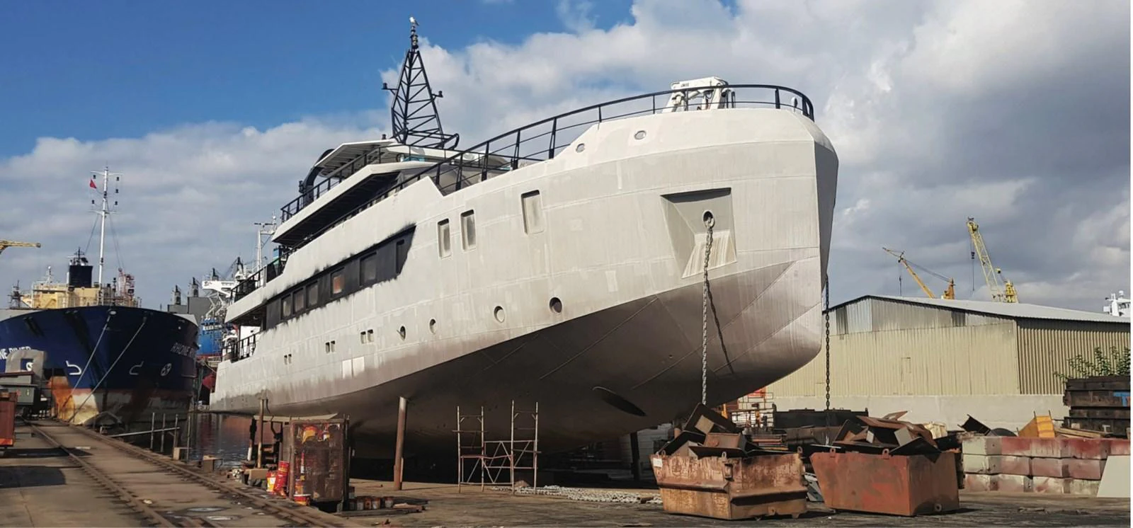 The yacht is seen in a shipyard, undergoing maintenance or construction. aboard NIRVANA Yacht for Sale