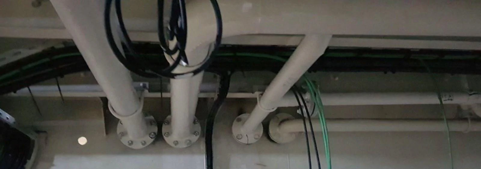 The image shows a detailed view of the yacht's mechanical or utility area with various pipes and cables. aboard NIRVANA Yacht for Sale
