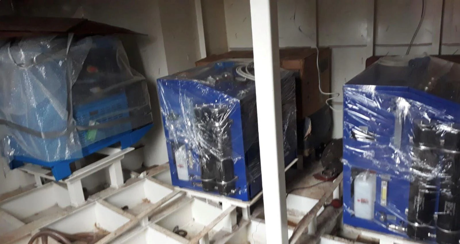 The image shows a technical area with machinery covered in plastic sheets. aboard NIRVANA Yacht for Sale