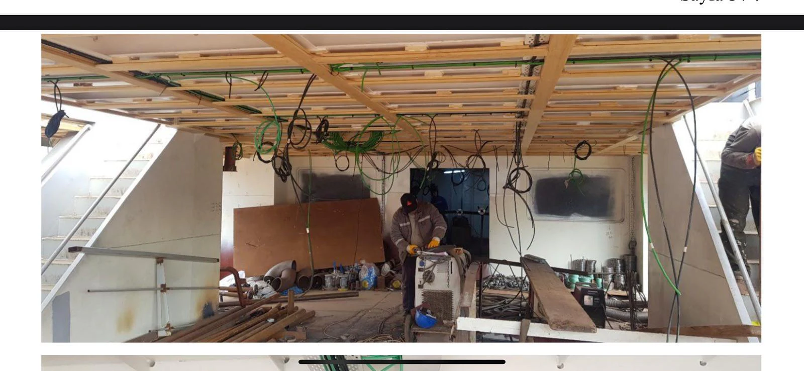 The image shows an interior space of a yacht under construction or renovation, with various tools and materials scattered around. aboard NIRVANA Yacht for Sale