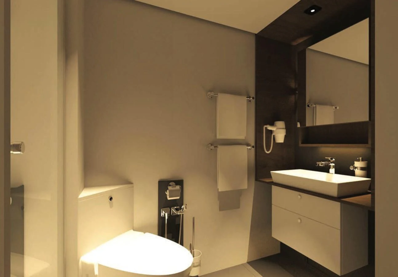 A modern and sleek bathroom with elegant fixtures and warm lighting. aboard NIRVANA Yacht for Sale