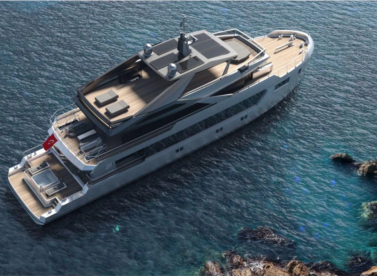 A sleek and modern yacht cruising in clear blue waters near a rocky shoreline. aboard SOYASLAN CUSTOM Yacht for Sale