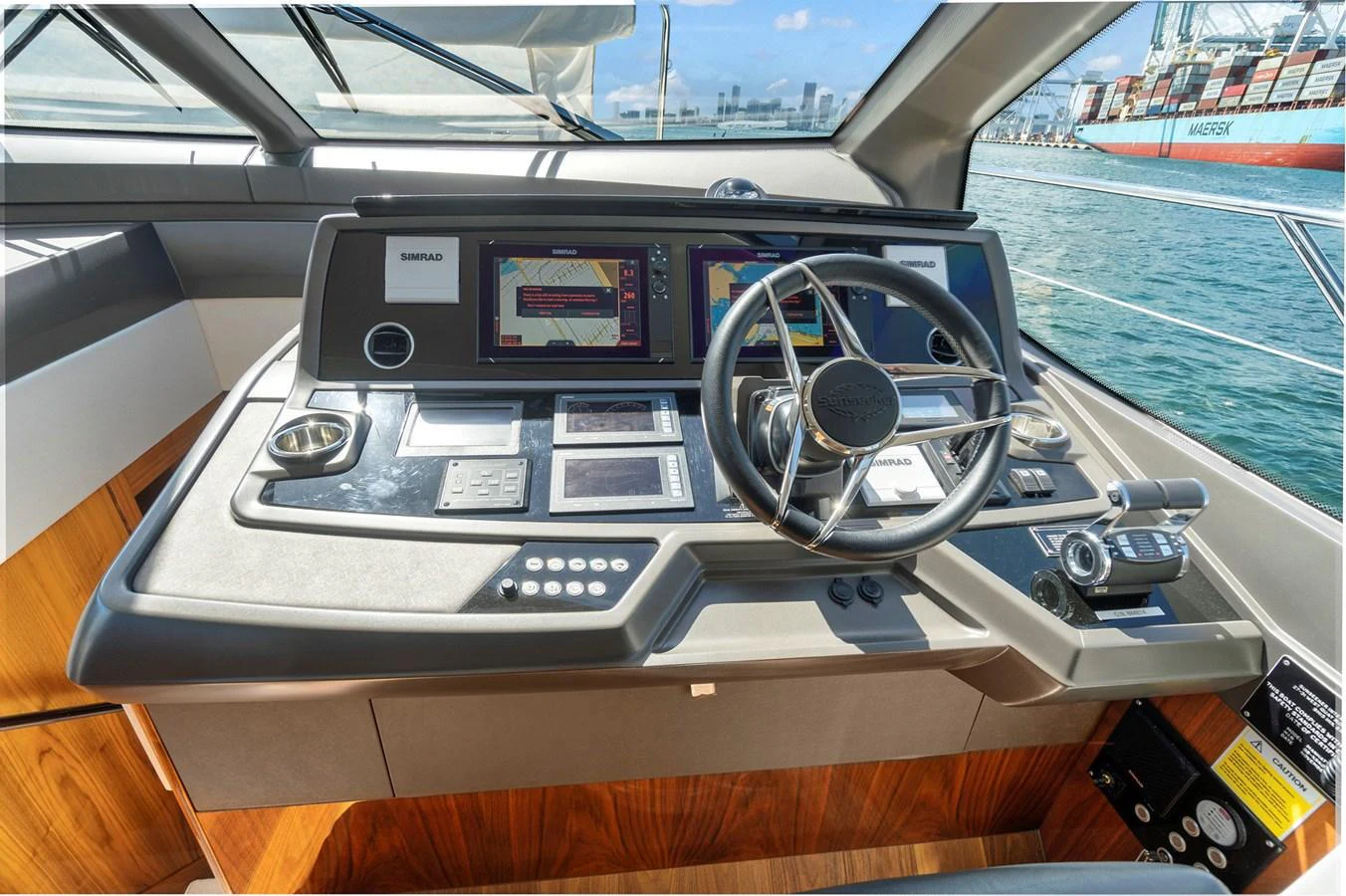 The helm station features advanced navigation equipment and a sleek, modern design. aboard EXIT Yacht for Sale