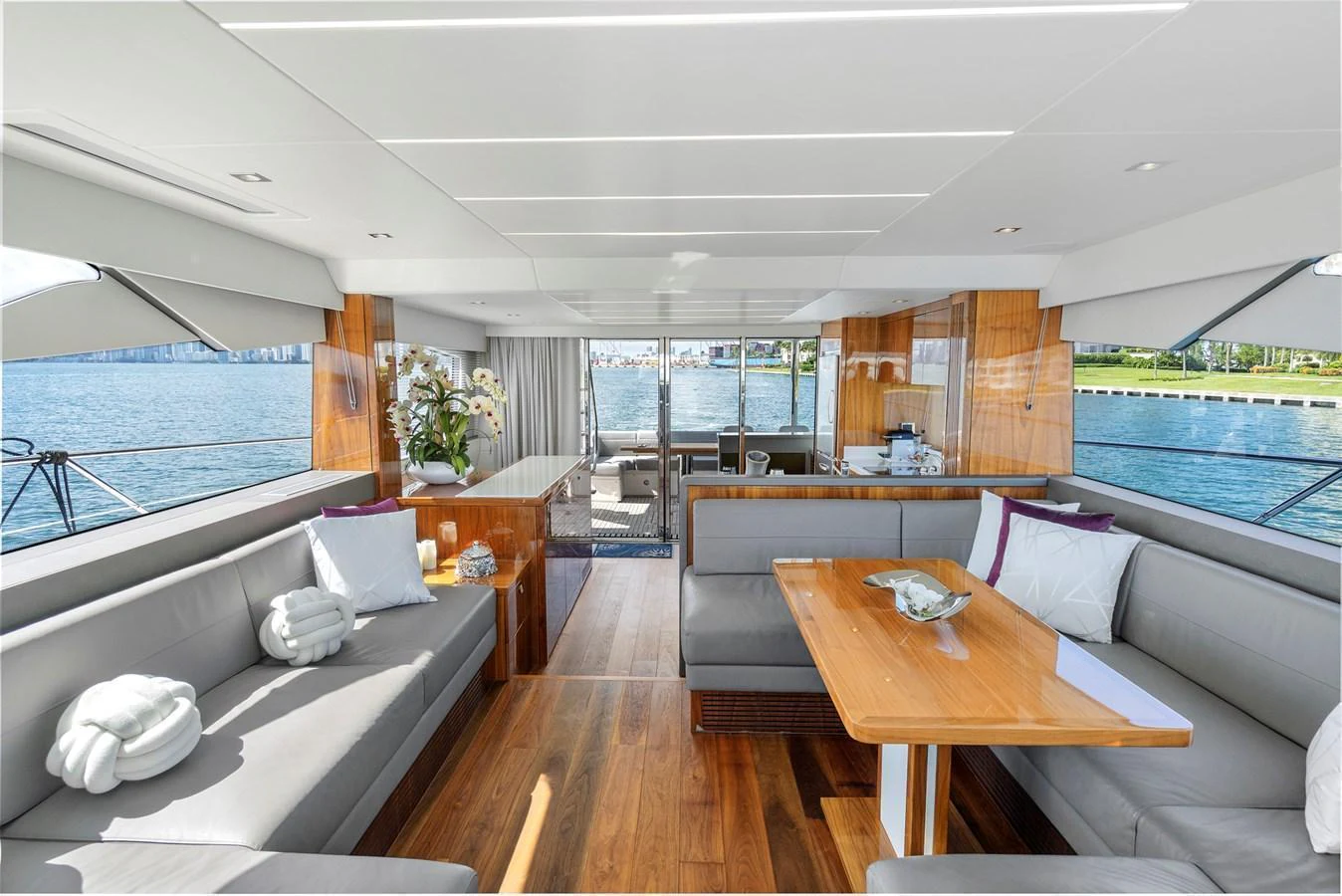 The salon offers a spacious and elegant area with comfortable seating and a stunning view of the water. aboard EXIT Yacht for Sale
