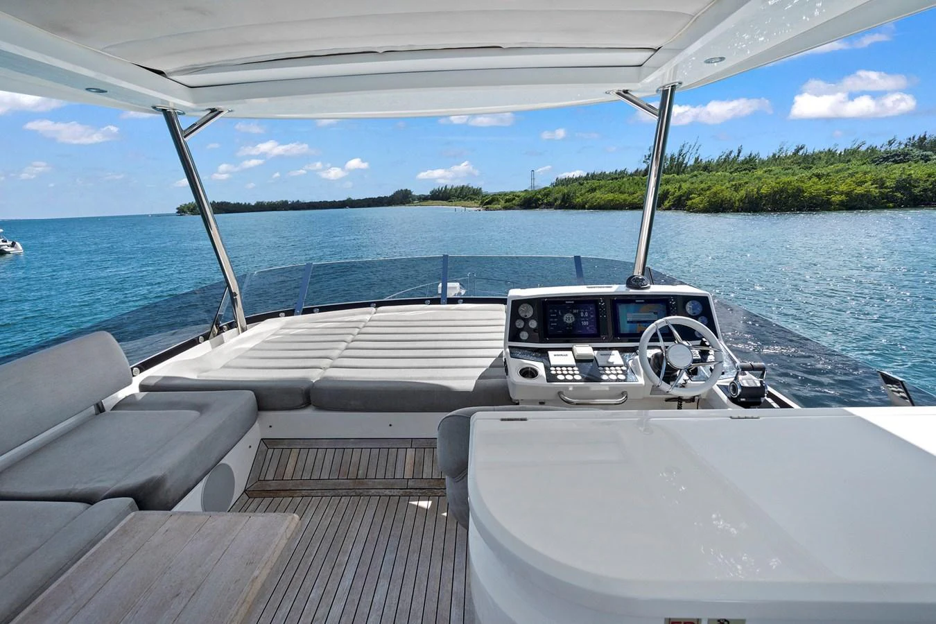 The flybridge offers a spacious and comfortable area with stunning views of the surrounding waters. aboard EXIT Yacht for Sale
