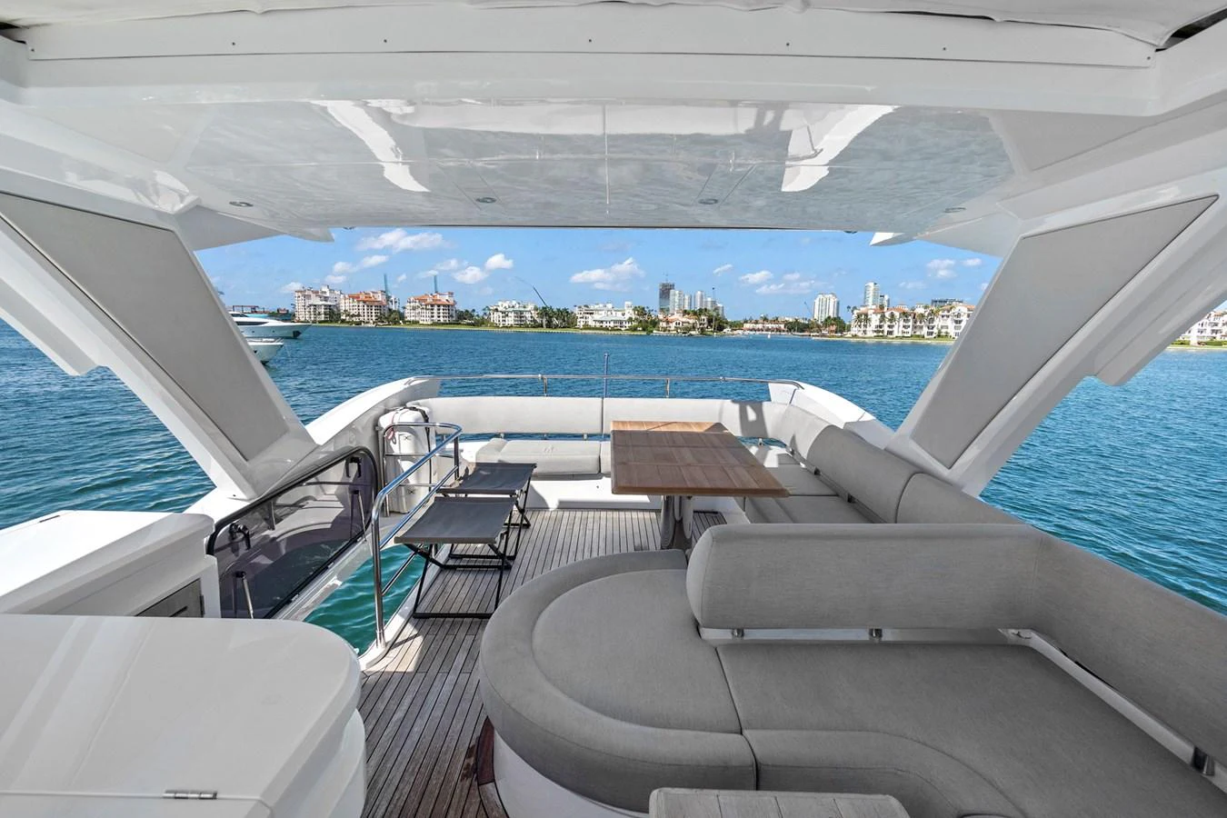 The aft deck offers a spacious and comfortable seating area with stunning views of the water. aboard EXIT Yacht for Sale