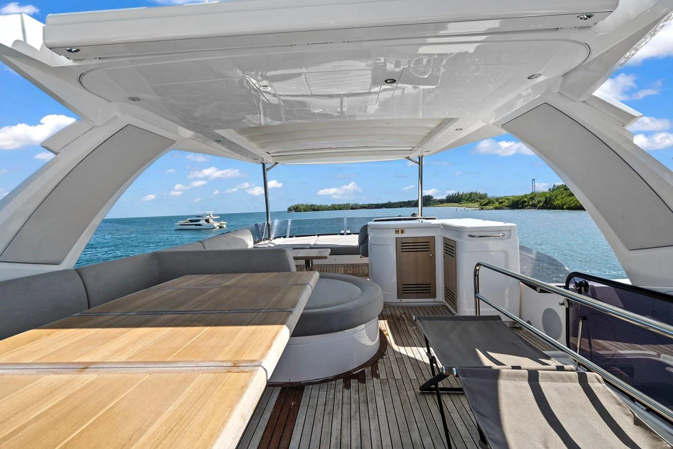 The flybridge offers a spacious and shaded area with comfortable seating and stunning views of the water. aboard EXIT Yacht for Sale