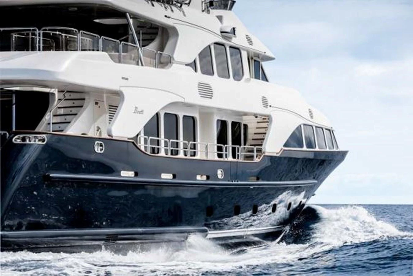 A luxurious yacht cruising through the water with a sleek and elegant design. aboard SOHO Yacht for Sale