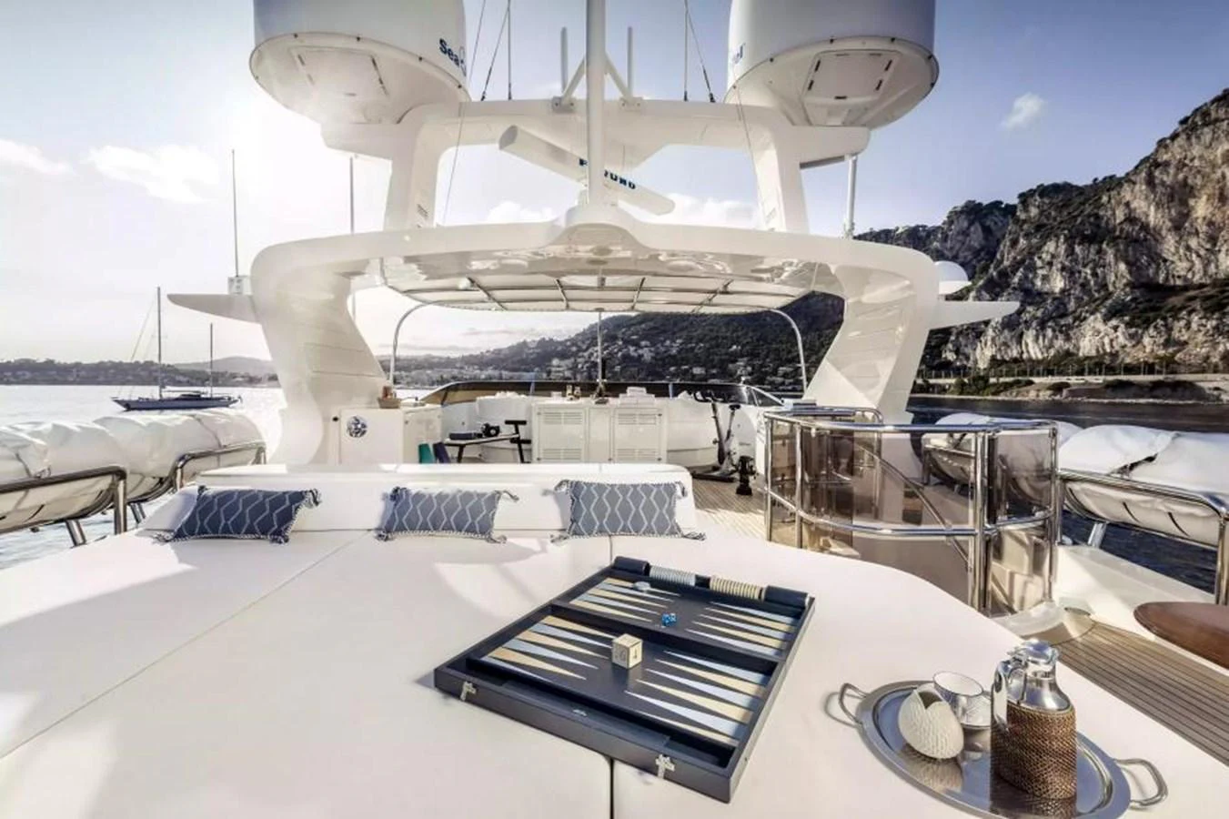 The sundeck offers a luxurious space for relaxation with ample seating and scenic views. aboard SOHO Yacht for Sale