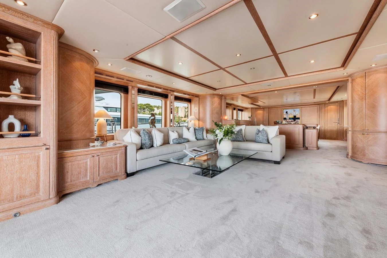 The spacious salon features elegant woodwork, plush seating, and a sophisticated ambiance. aboard SOHO Yacht for Sale