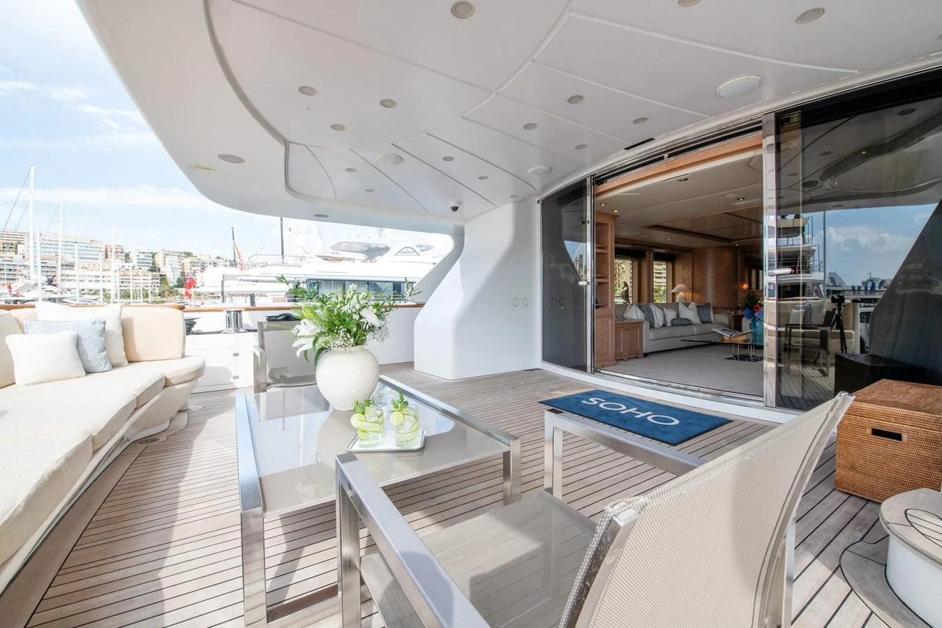 The aft deck offers a spacious and inviting area for relaxation and socializing with comfortable seating and elegant decor. aboard SOHO Yacht for Sale