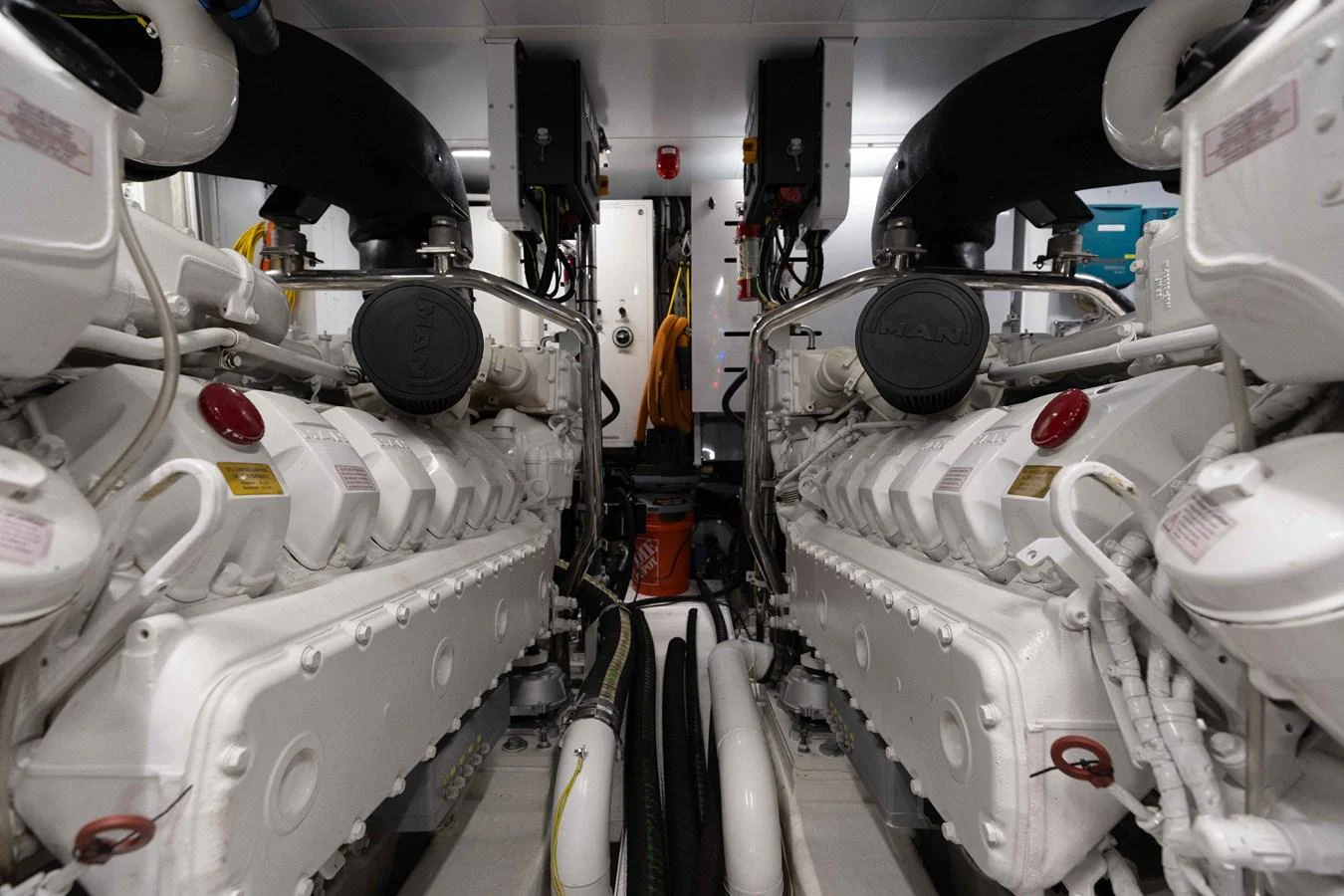 The image showcases the yacht's engine room with powerful twin engines. aboard CHAMELEON Yacht for Sale