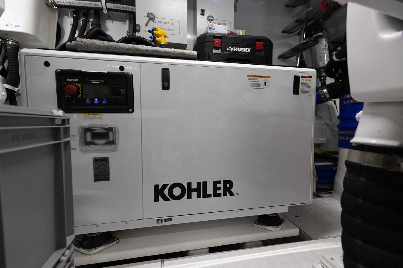 The image showcases a Kohler generator in the yacht's engine room, highlighting its technical equipment. aboard CHAMELEON Yacht for Sale