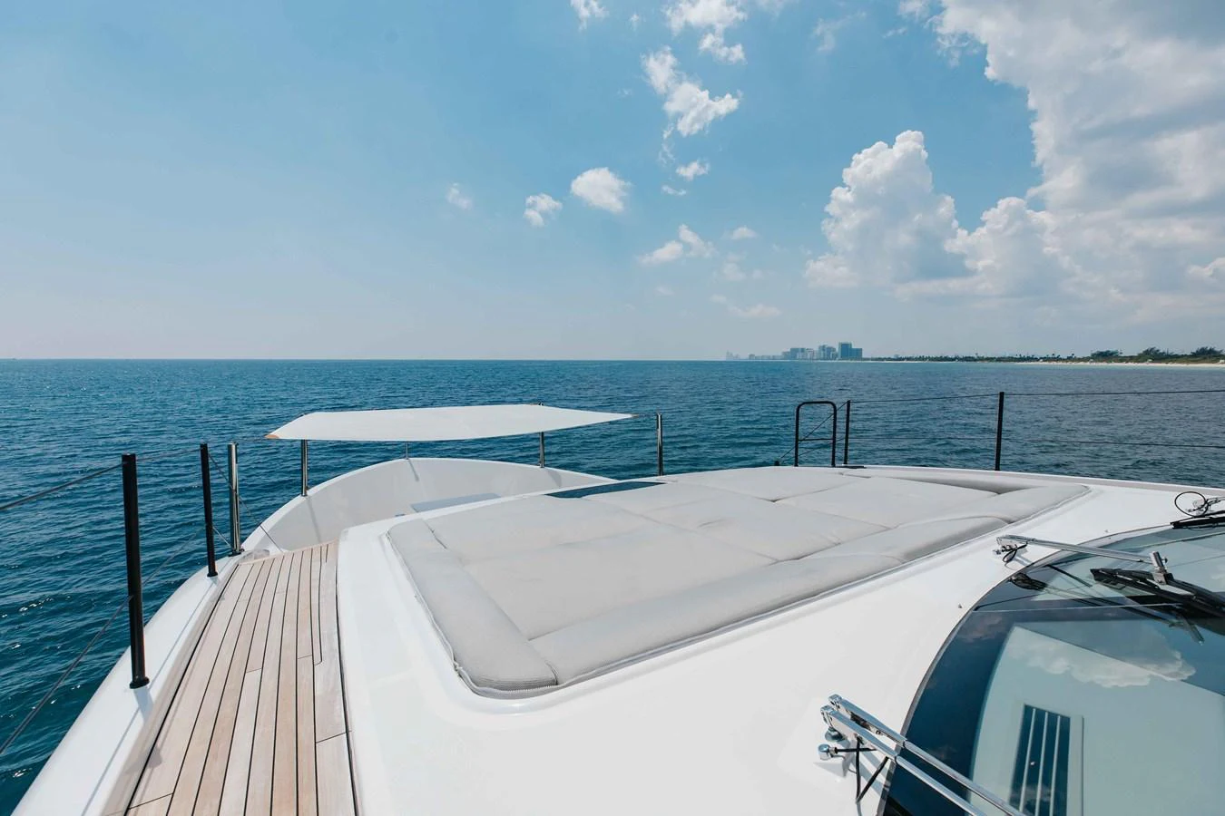 The yacht's foredeck offers a spacious sunbathing area with stunning ocean views. aboard CHAMELEON Yacht for Sale
