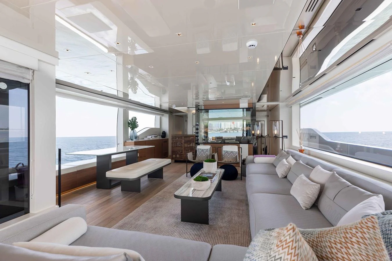 The spacious salon offers a luxurious and comfortable setting with panoramic ocean views. aboard CHAMELEON Yacht for Sale