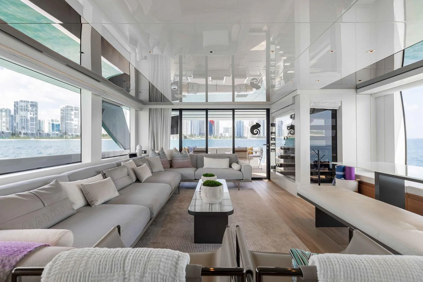 The spacious salon offers panoramic views and luxurious seating arrangements. aboard CHAMELEON Yacht for Sale