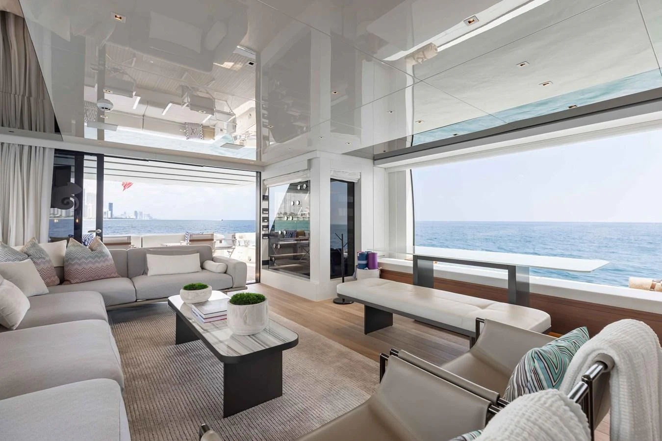 The salon offers a spacious and modern living area with panoramic ocean views. aboard CHAMELEON Yacht for Sale