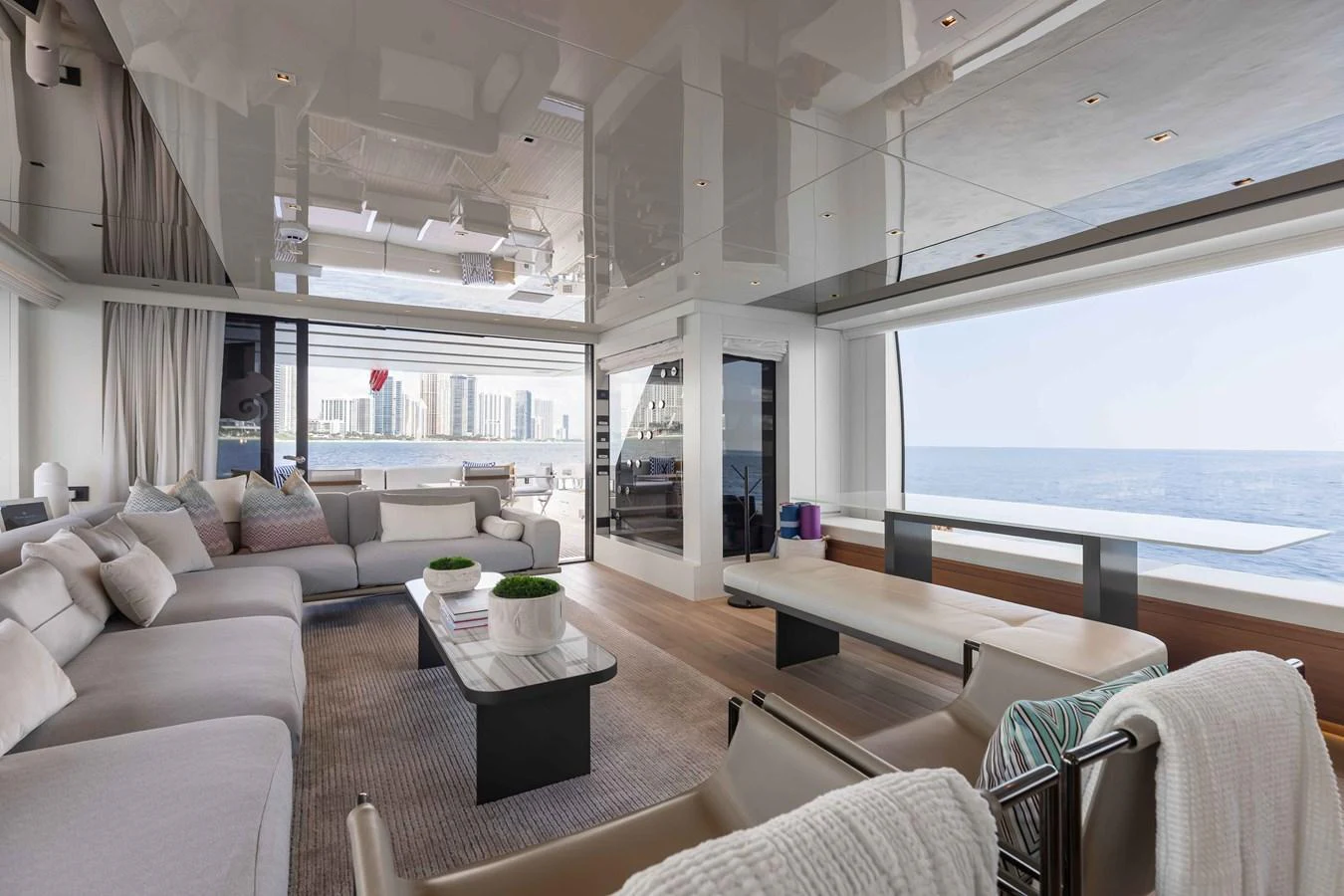 The spacious salon offers panoramic views and luxurious seating, perfect for relaxation and socializing. aboard CHAMELEON Yacht for Sale