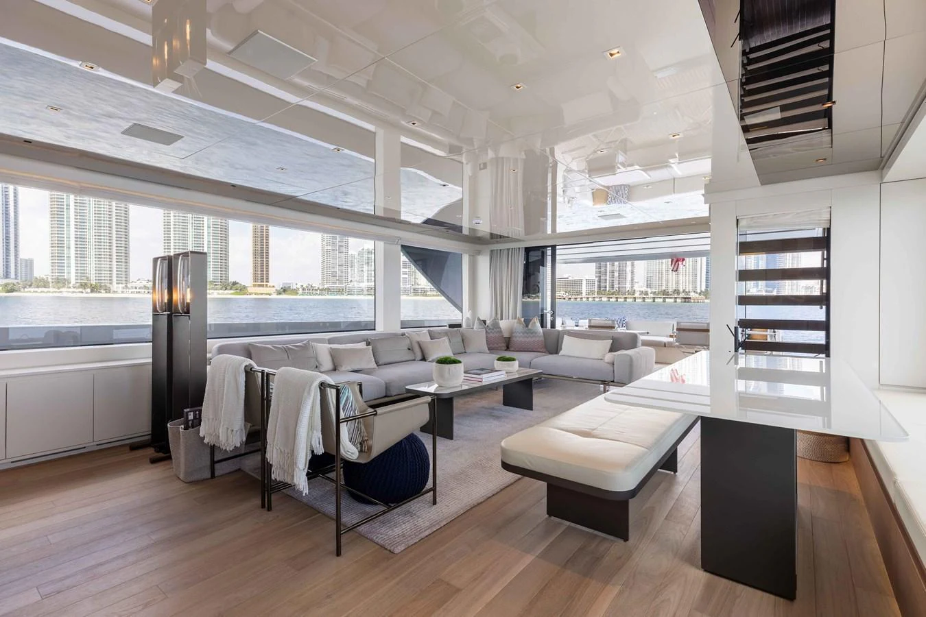 The spacious salon features contemporary furnishings and large windows offering panoramic views. aboard CHAMELEON Yacht for Sale