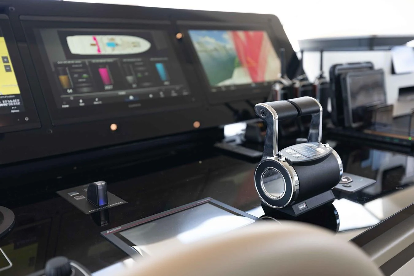 The helm features advanced navigation and control systems with sleek, modern instrumentation. aboard CHAMELEON Yacht for Sale