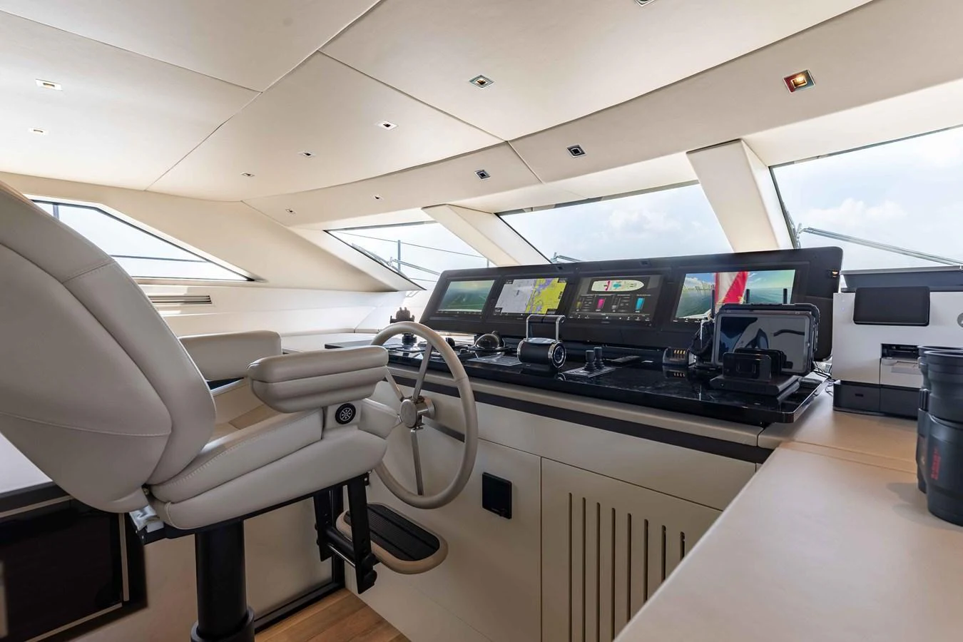 The helm station features advanced navigation equipment and a comfortable captain's chair. aboard CHAMELEON Yacht for Sale