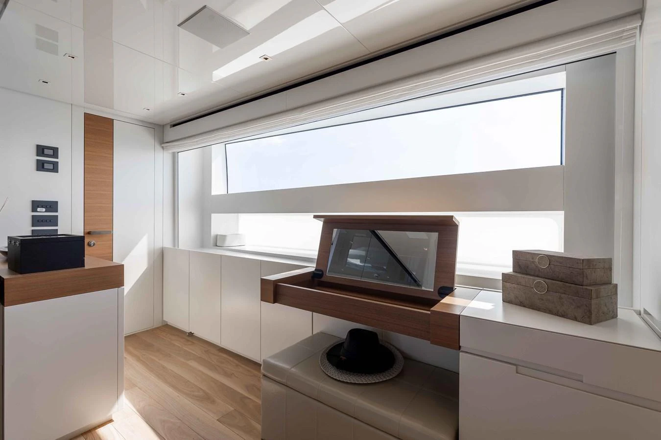 A modern and sleek interior space with ample natural light and stylish furnishings. aboard CHAMELEON Yacht for Sale