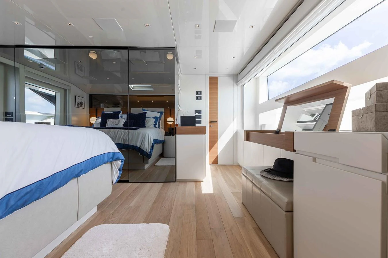 A luxurious stateroom with modern decor and ample natural light. aboard CHAMELEON Yacht for Sale