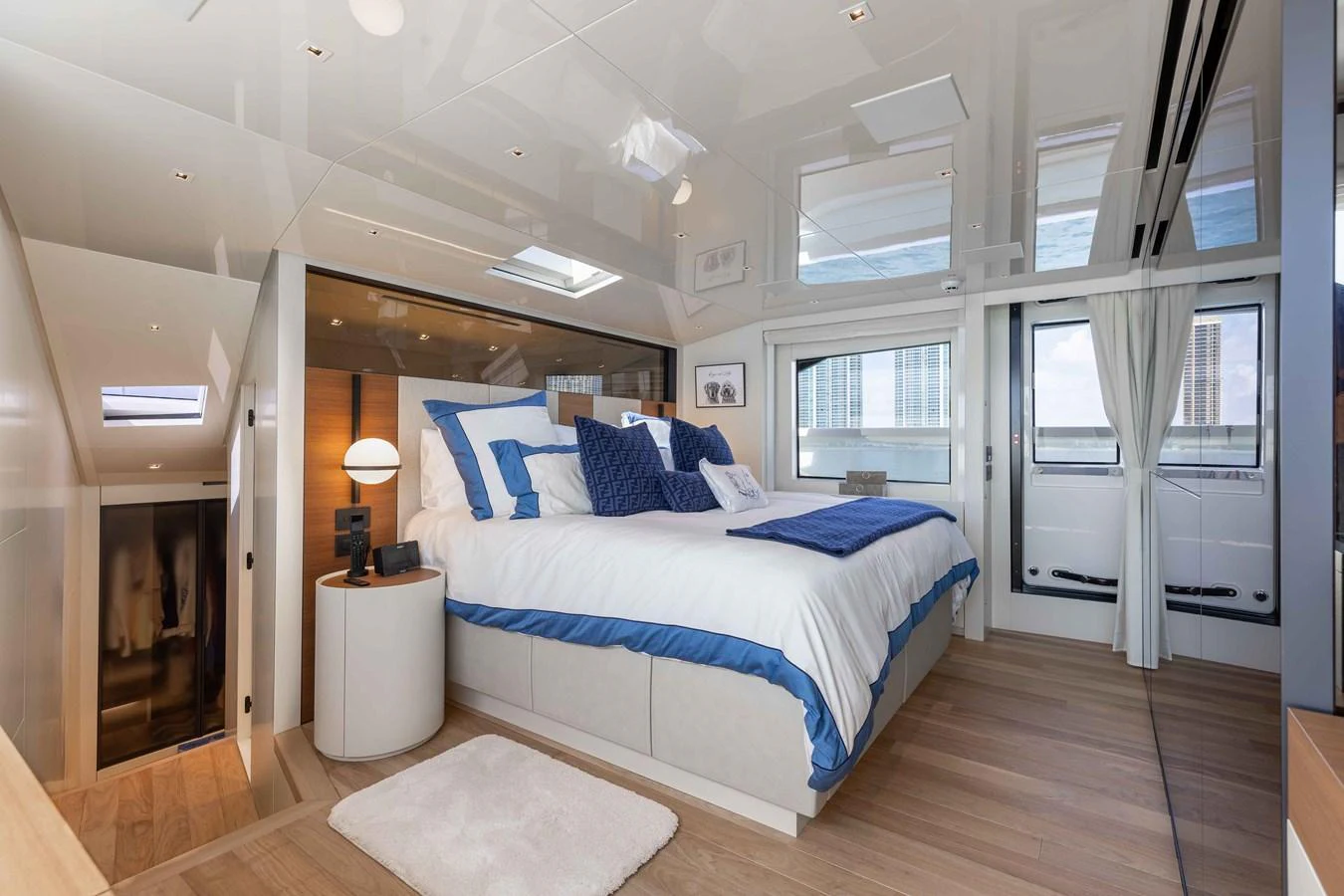 The master stateroom features a luxurious bed with plush bedding and ample natural light. aboard CHAMELEON Yacht for Sale