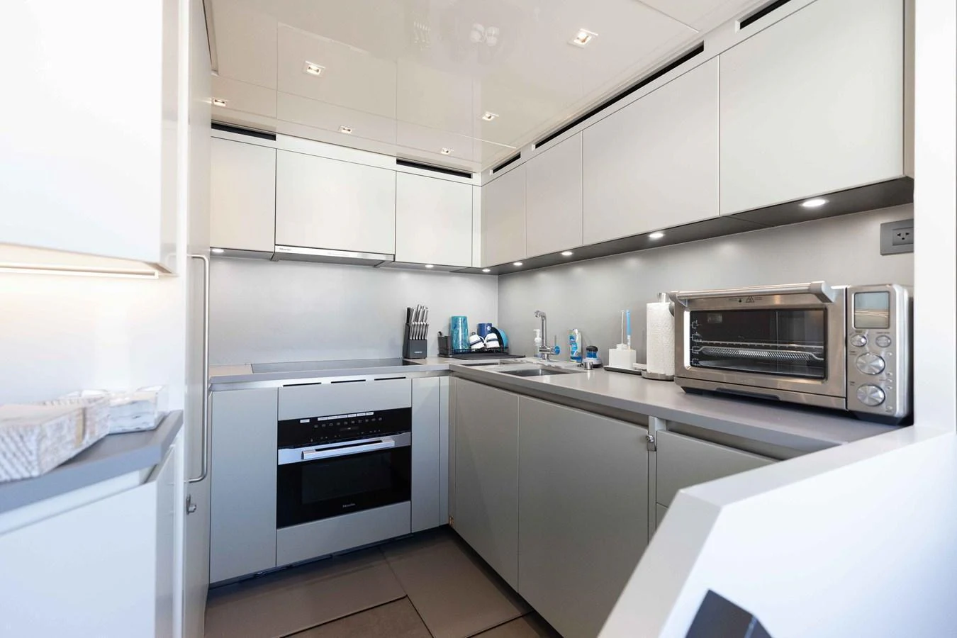 The modern galley is equipped with sleek appliances and ample storage, perfect for gourmet cooking at sea. aboard CHAMELEON Yacht for Sale