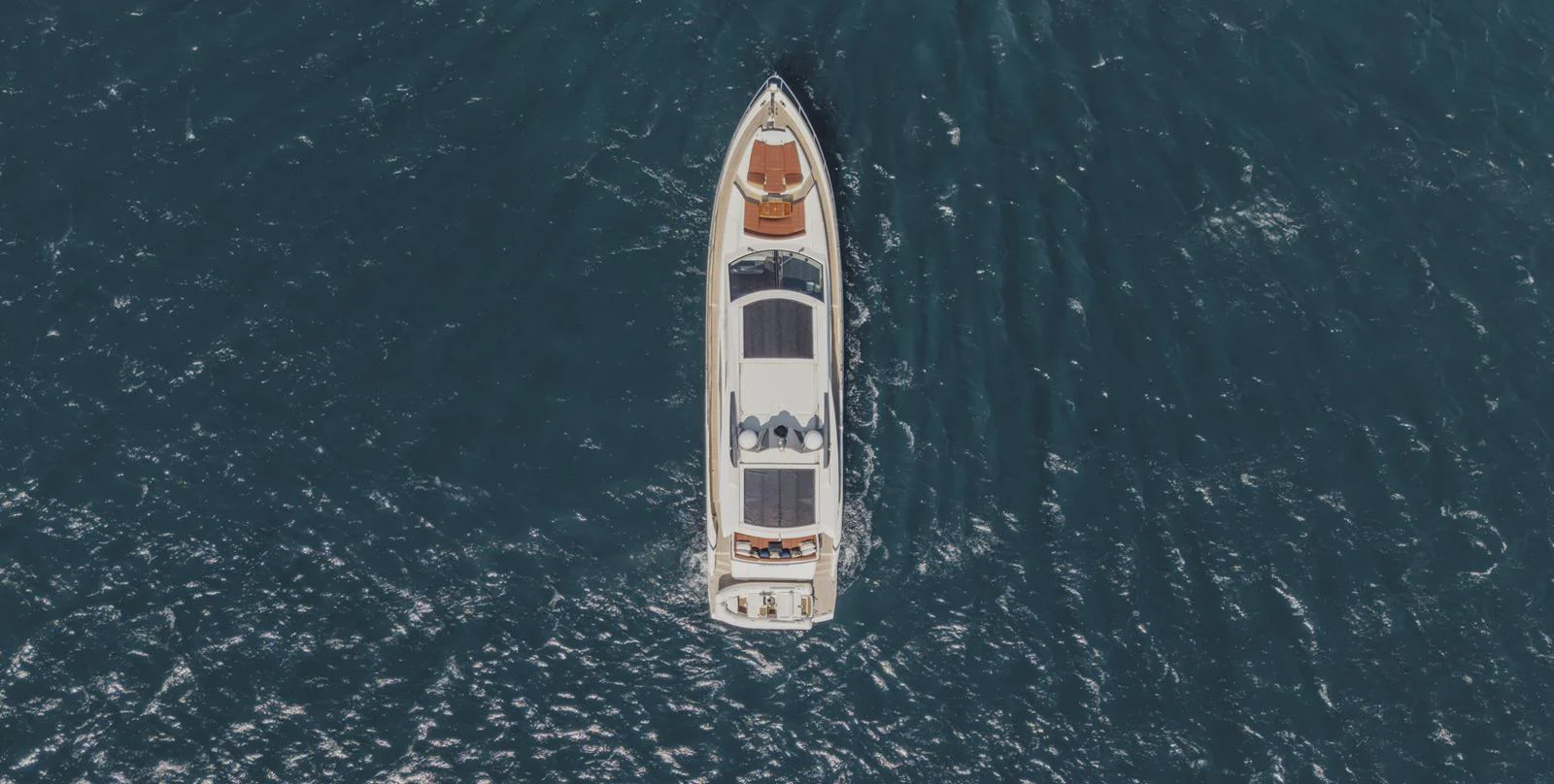 a white boat in the water aboard SCUDERIA Yacht for Sale