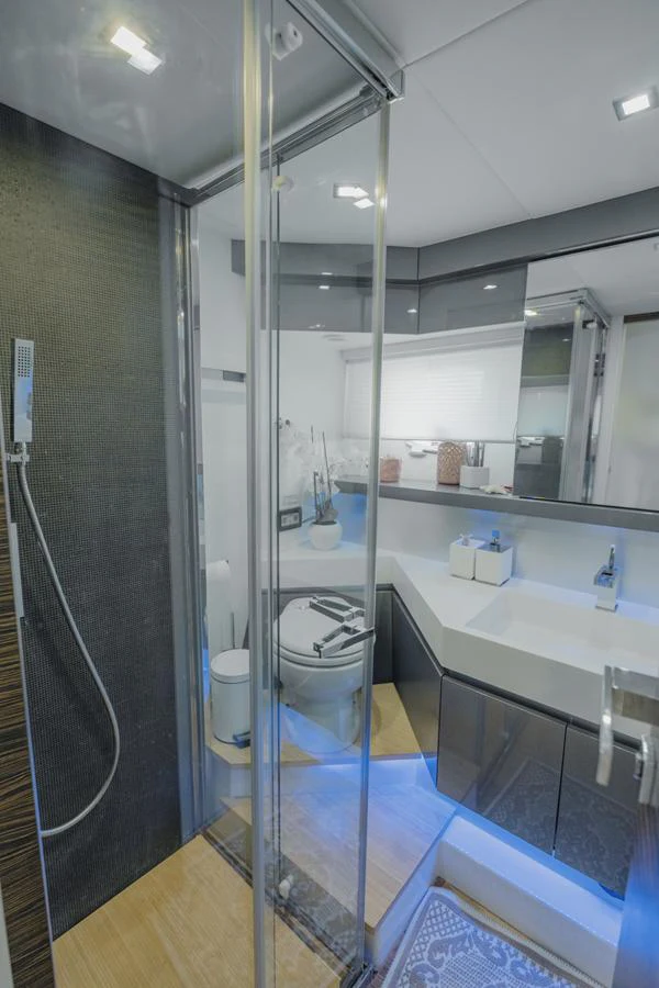 a bathroom with a glass shower aboard SCUDERIA Yacht for Sale