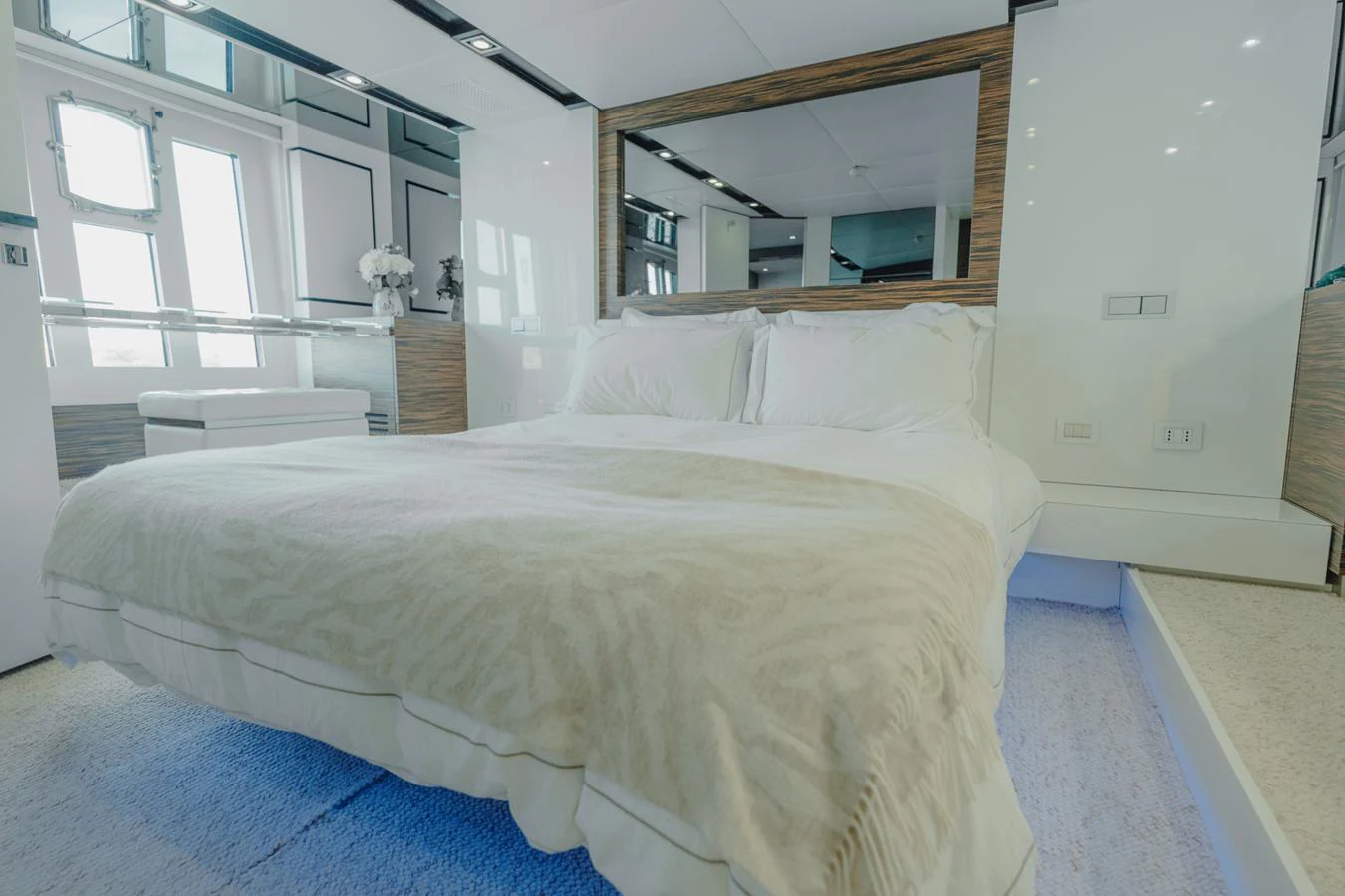 a large white bed in a room aboard SCUDERIA Yacht for Sale