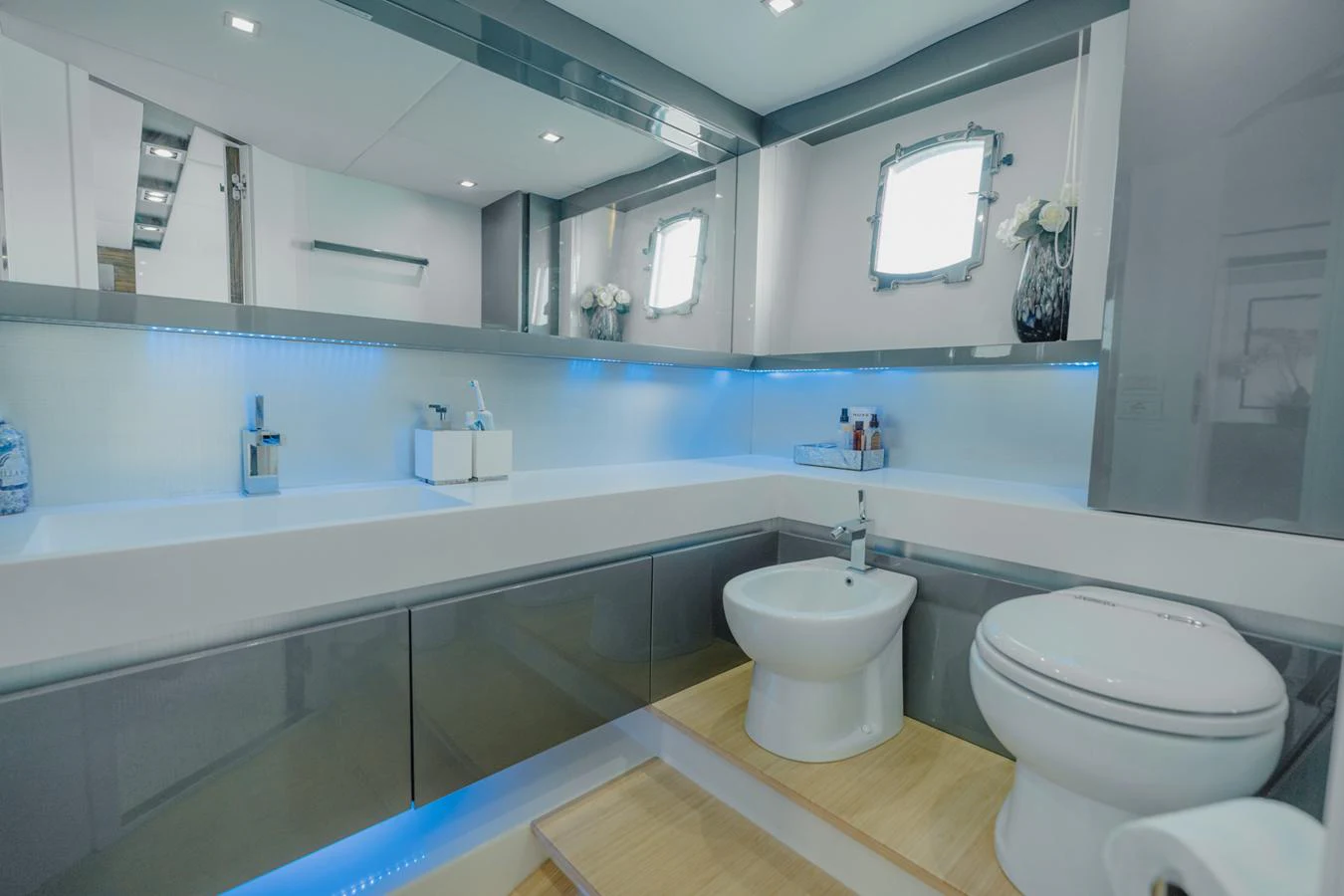 a bathroom with a large mirror aboard SCUDERIA Yacht for Sale