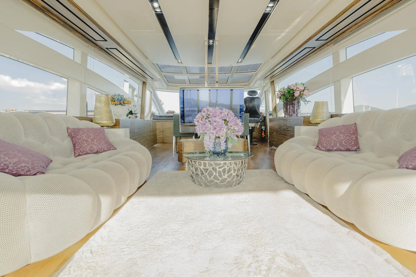 a room with a bed and a chair aboard SCUDERIA Yacht for Sale