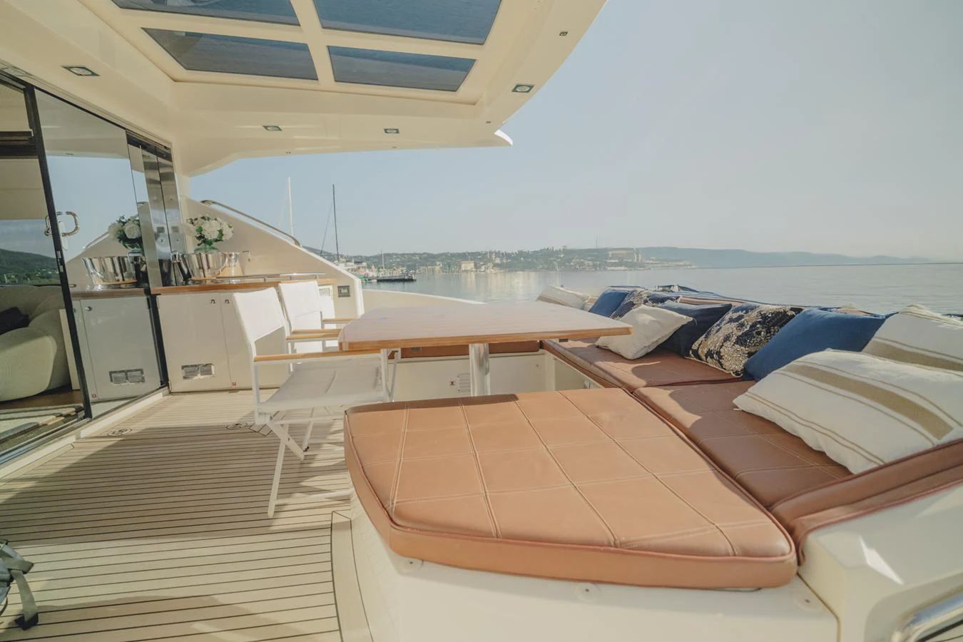 a room with a bed and a view of the ocean aboard SCUDERIA Yacht for Sale