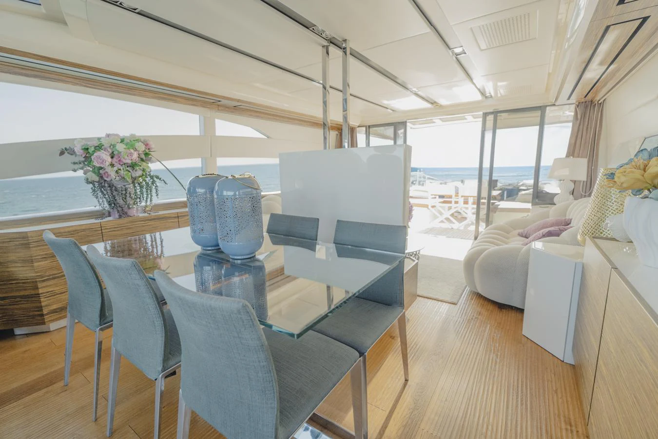 a living room with a large window aboard SCUDERIA Yacht for Sale
