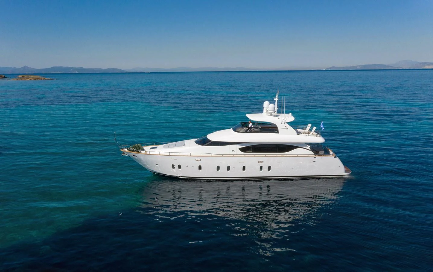 a white yacht in the water aboard EL PECADO Yacht for Sale