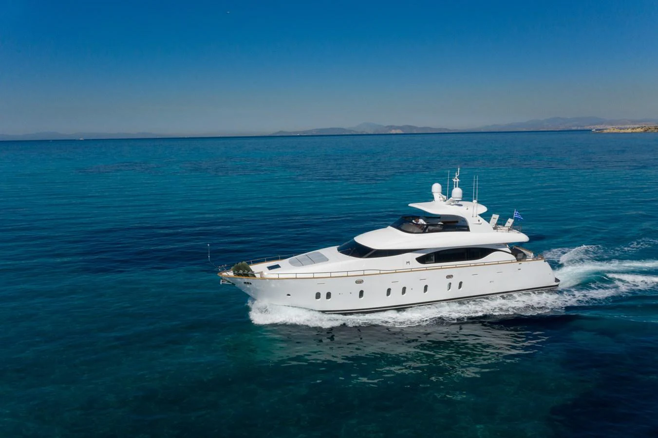 a white yacht in the water aboard EL PECADO Yacht for Sale