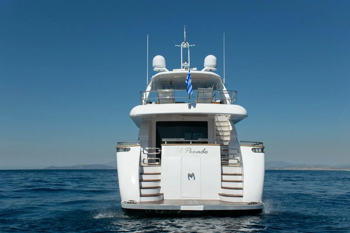 a white and grey boat in the water aboard EL PECADO Yacht for Sale