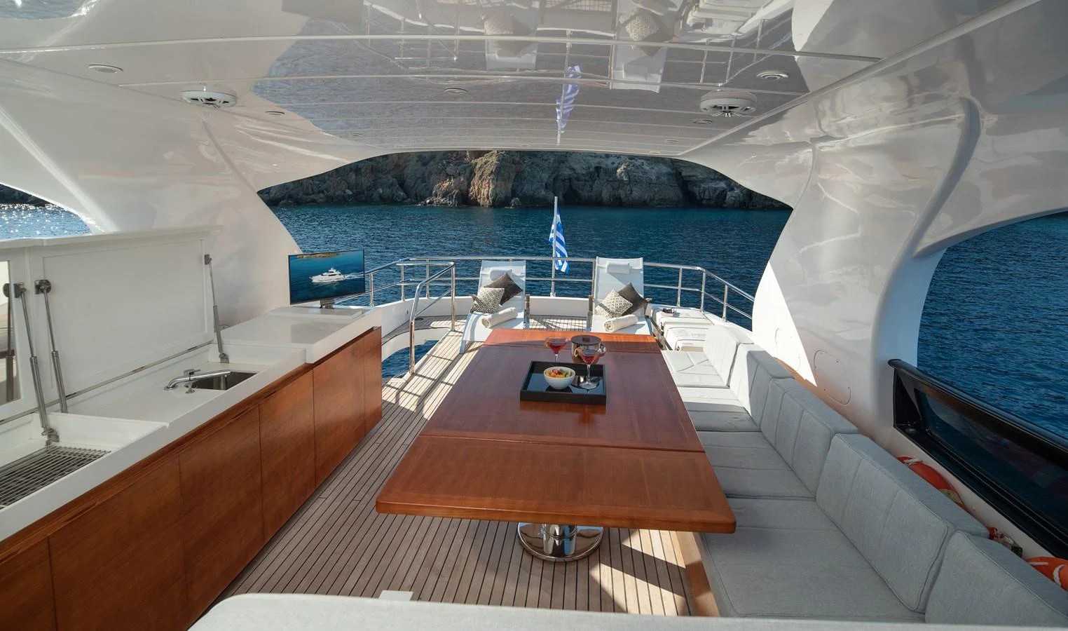 a room with a table and chairs aboard EL PECADO Yacht for Sale
