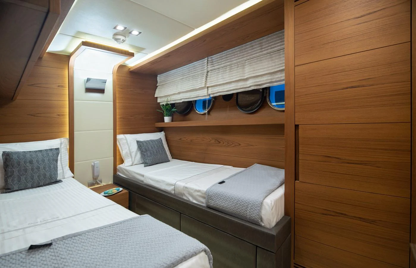 a room with two beds aboard EL PECADO Yacht for Sale