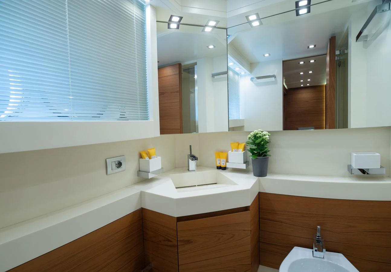 a bathroom with a large mirror aboard EL PECADO Yacht for Sale