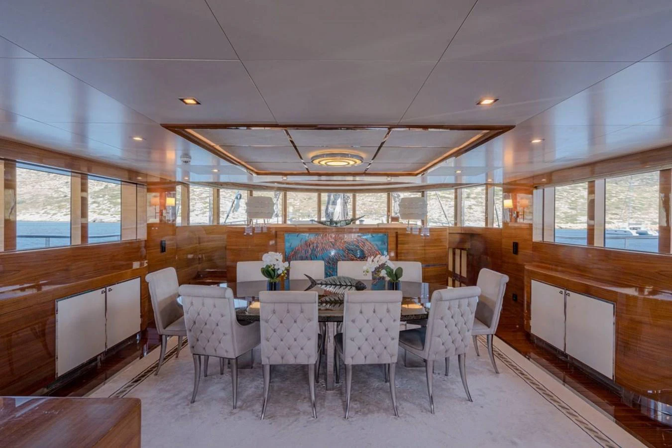 a dining room with a table and chairs aboard ATLANTIS PEARL Yacht for Sale