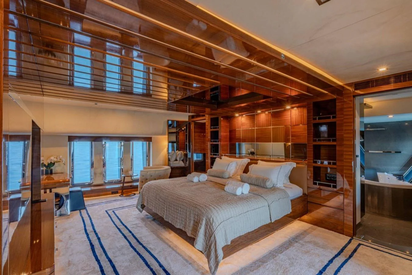 a large bed in a room aboard ATLANTIS PEARL Yacht for Sale