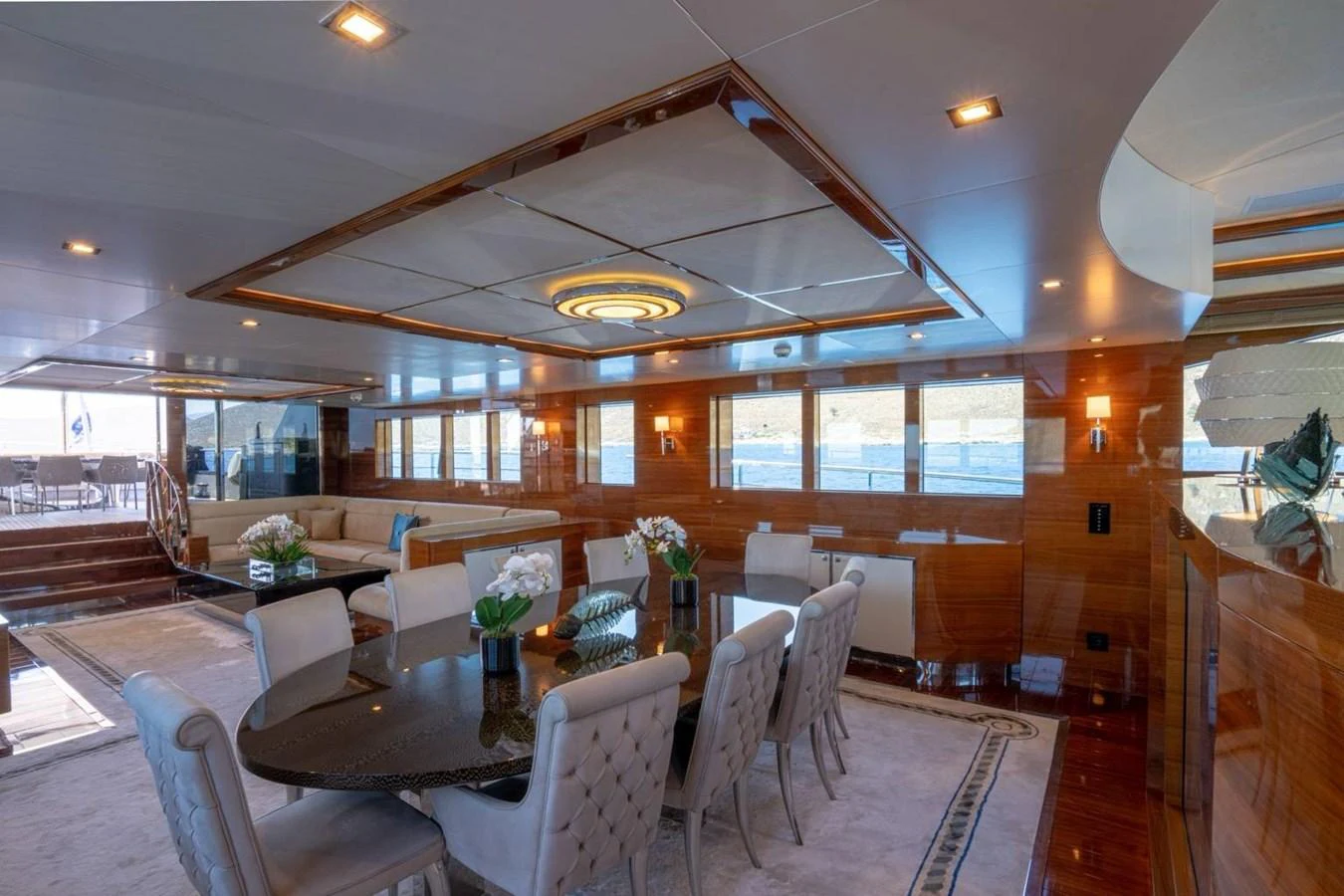 a room with tables and chairs aboard ATLANTIS PEARL Yacht for Sale