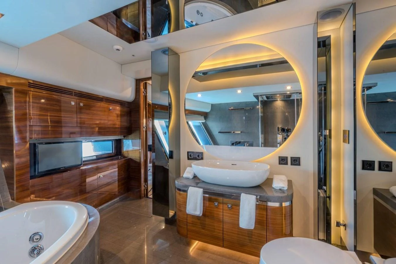 a bathroom with a large mirror aboard ATLANTIS PEARL Yacht for Sale
