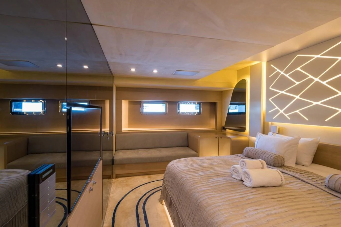 a room with a bed and a tv aboard ATLANTIS PEARL Yacht for Sale