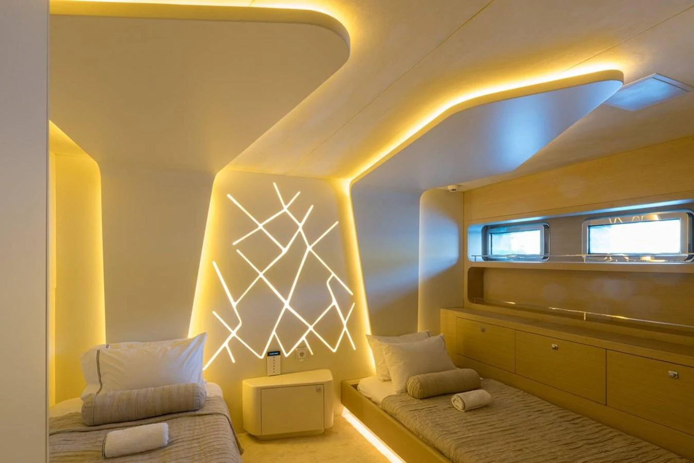 a room with a bed and a couch aboard ATLANTIS PEARL Yacht for Sale