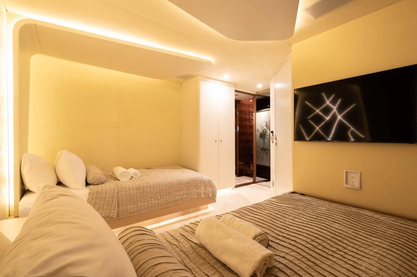 a room with two beds aboard ATLANTIS PEARL Yacht for Sale