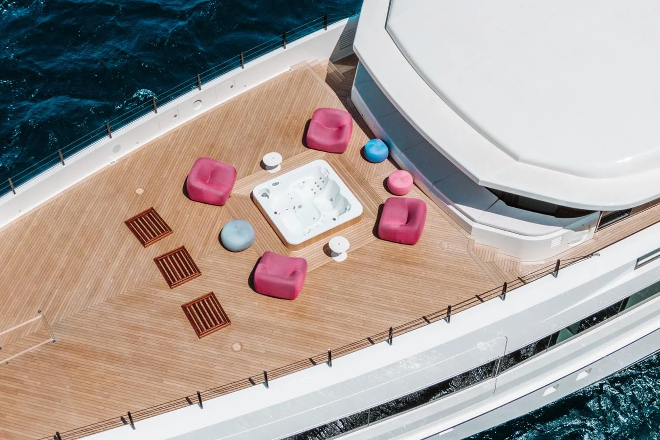 The sundeck features a luxurious hot tub surrounded by stylish seating, perfect for relaxation. aboard RIO Yacht for Sale